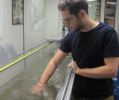 A physics student using the flume lab. 