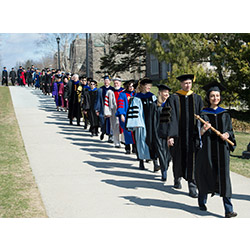 Delegates, wearing the colorful regalia of their institutions, take part in the processional leading Bergeron to Palmer Auditorium for the Inauguration.  
