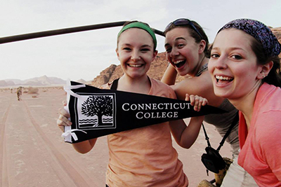 Students in the Jordan Arabic Summer Program with a Connecticut College pennant