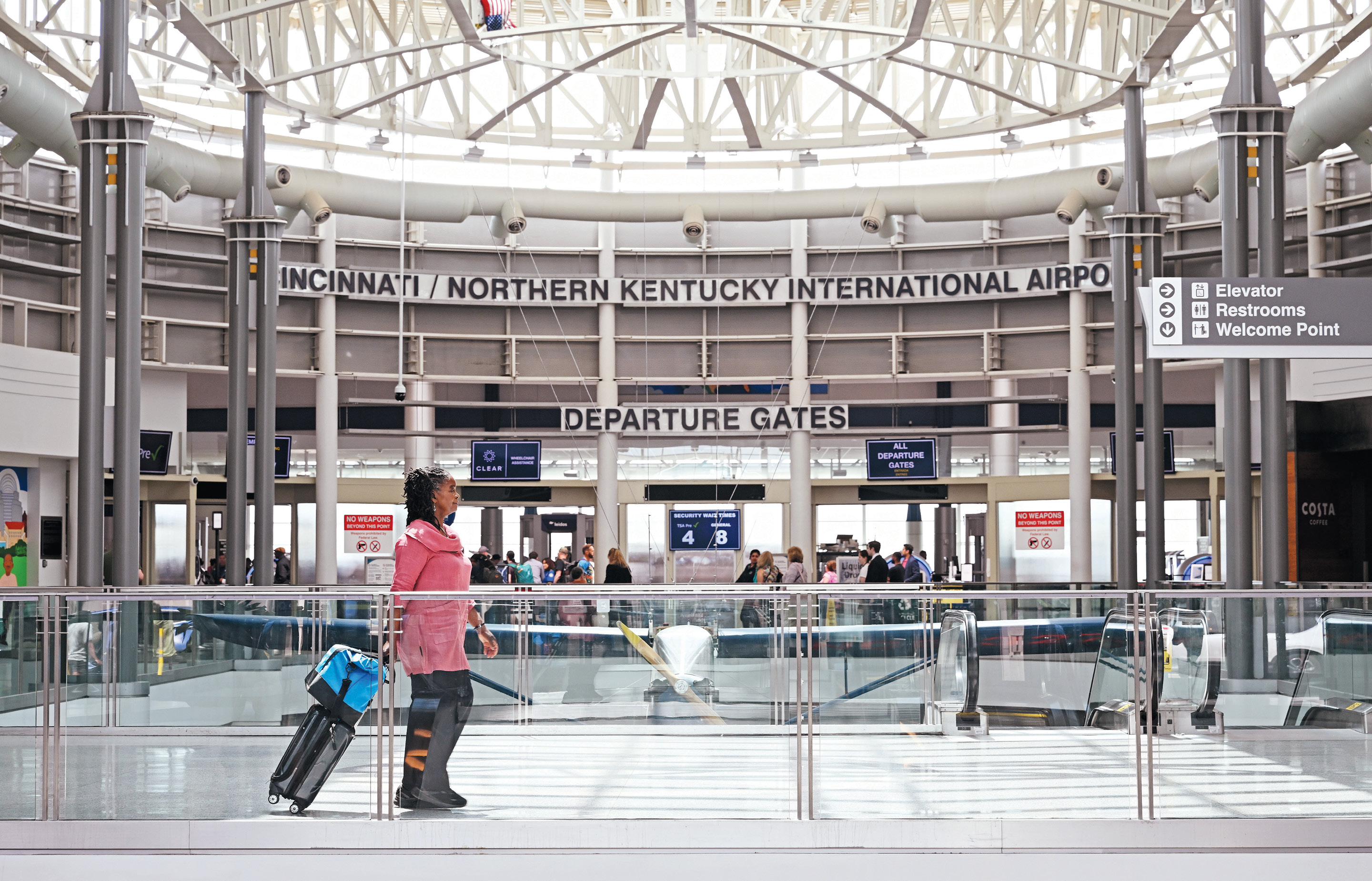 Volunteer medical courier Marsha Williams ’81 at the Cincinnati/Northern Kentucky International Airport.