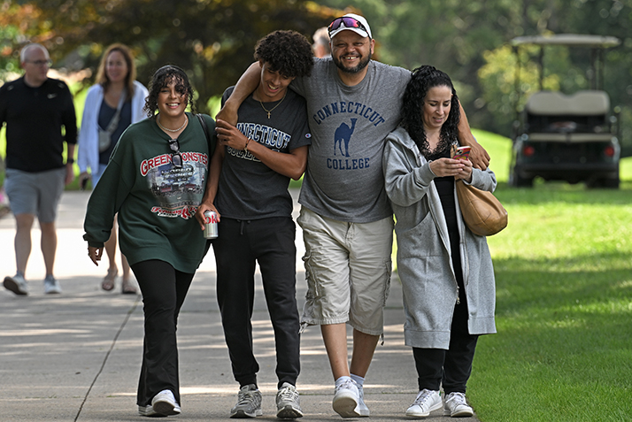 A family walks together along Tempel Green.