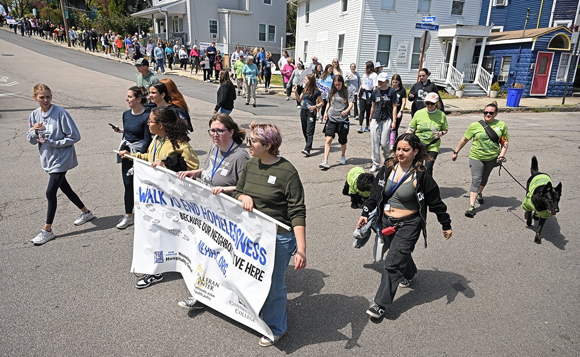 Students carry a banner to lead a march